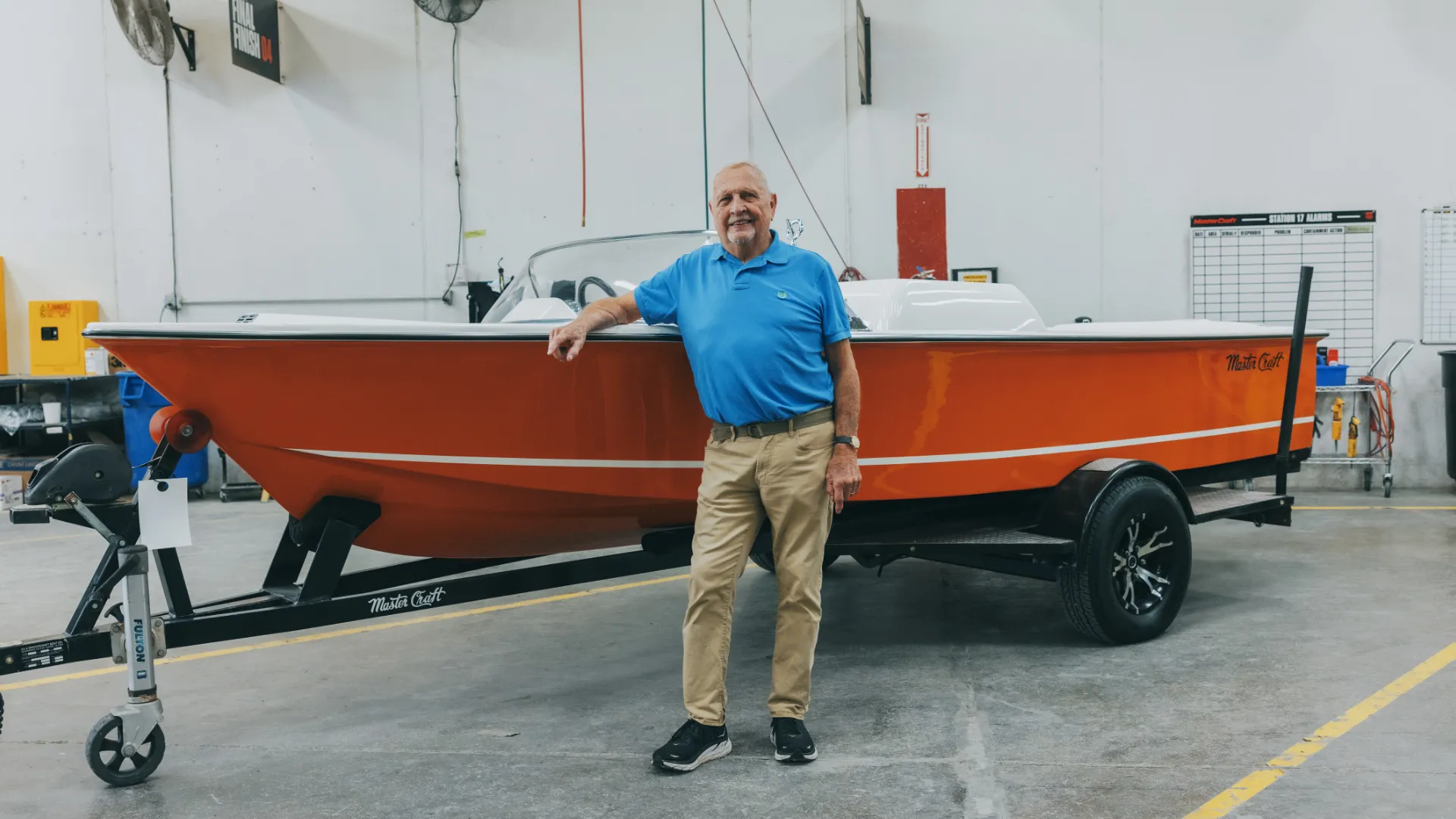 Person standing next to a boat